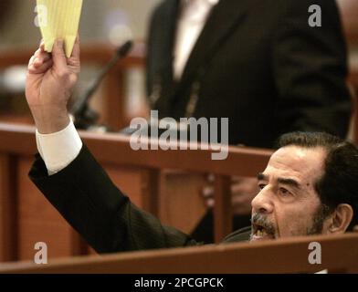 Saddam Hussein argues with Chief Judge Raouf Rashid Abdel-Rahman, not ...