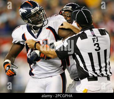 Denver Broncos linebacker Keith Burns jokes with teammates as the