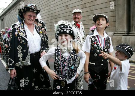 Pearly Kings and Queens celebrate the harvest festival, wearing their ...