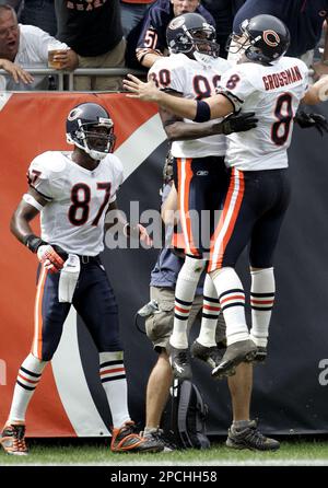 Cedric Benson of the Chicago Bears celebrates his touchdown with Rex