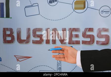 Business trainer with pen using interactive board, closeup Stock Photo