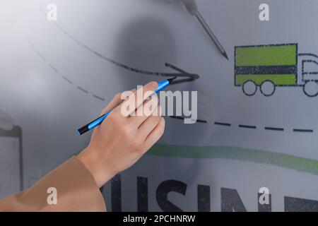 Business trainer with pen using interactive board, closeup Stock Photo
