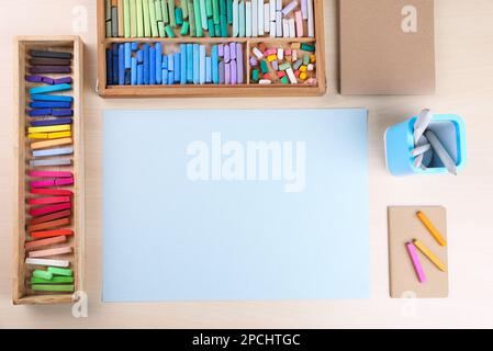 Soft pastels for artists and drawing paper on the wooden table Stock Photo  - Alamy