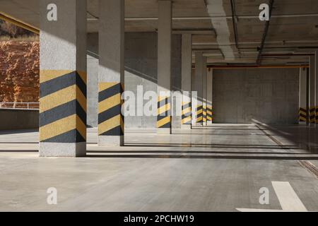 Empty open car parking garage on sunny day Stock Photo