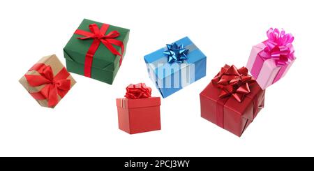 Beautifully wrapped gift boxes flying on white background Stock Photo