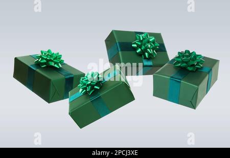 Beautifully wrapped gift boxes flying on light background Stock Photo