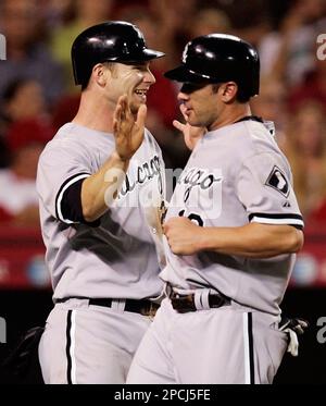 Chicago White Sox's Joe Crede, left, gets a cleat to the neck as Baltimore  Orioles' Miguel Tejada completes a double play that caught Crede and Ross  Gload out in the fifth inning