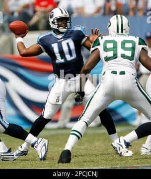 Tennessee Titans rookie quarterback Vince Young (10) is pressured by New  Orleans Saints defensive end Tommy Davis (96) in the fourth quarter of  their pre-season football game in Nashville, Tenn., on Saturday