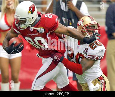 Arizona Cardinals receiver Bryant Johnson (80) is pulled down by San  Francisco 49ers Mike Adams (20) during the first quarter of NFL football  action Sunday, Sept. 10, 2006 at Cardinals Stadium in