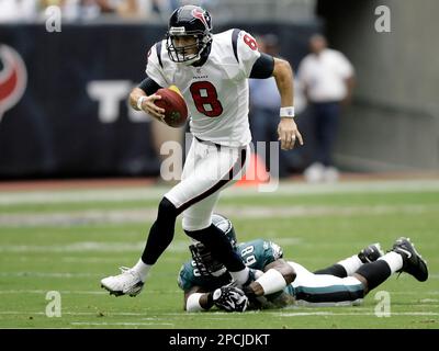 HOUP2002090801 - Houston, Sept. 8, (UPI) -- Houston Texans quarterback  David Carr (8) tries to escape the Dallas Cowboys defense during the 2nd  quarter on Sept. 8, 2002, in Houston. The Texans