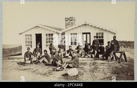 Group of soldiers outside winter quarters. No. 285, Title devised by library staff, Gift; Col. Godwin Ordway; 1948. United States, History, Civil War, 1861-1865. Stock Photo