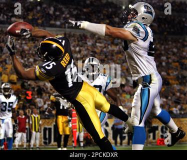 KRT SPORTS STORY SLUGGED: PANTHERS-BRONCOS KRT PHOTOGRAPH BY PATRICK  SCHNEIDER/CHARLOTTE OBSERVER (October 10) DENVER, CO -- Denver Broncos wide  receiver Darius Watts leaps over Carolina Panthers safety Colin Branch (28)  during game