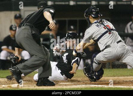 Chicago White Sox's Joe Crede, left, gets a cleat to the neck as Baltimore  Orioles' Miguel Tejada completes a double play that caught Crede and Ross  Gload out in the fifth inning