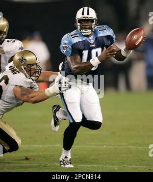 Tennessee Titans rookie quarterback Vince Young (10) is pressured by New  Orleans Saints defensive end Tommy Davis (96) in the fourth quarter of  their pre-season football game in Nashville, Tenn., on Saturday