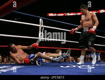 David Diaz right of Chicago Ill. knocks down Jose Armando