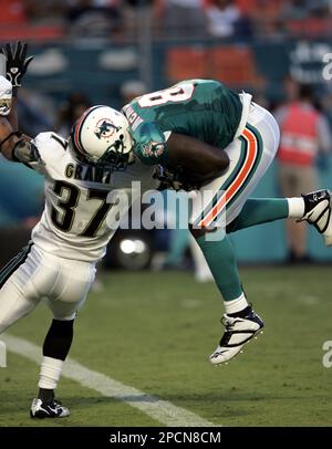 Pittsburgh Steelers Strong Safety Troy Polamalu (43) tackles Miami Dolphins  Tight End Randy McMichael (81) during a second quarter downpour on  September 26, 2004 at Pro Player Stadium in Miami, Fl. The