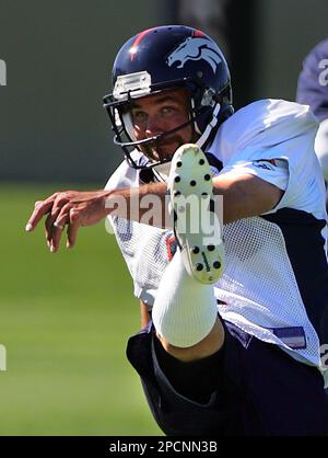 Denver Broncos kicker Jason Elam (1) hops in pain after kicking a