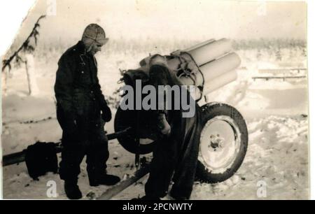 World War Two B&W photo German Soldiers load a Nebelwerfer Rocket Launcher in the Winter of 1943 on the Russian Front Stock Photo