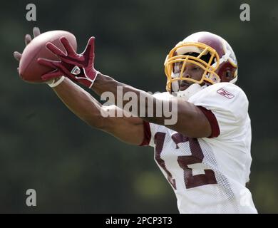 Washington Redskins wide receiver Maurice Harris (13) gets tackled