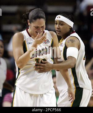 Seattle Storm's Betty Lennox, right, checks on teammate Sue Bird after Bird  got hit in the nose in the first quarter against the Washington Mystics,  during an WNBA basketball game, Thursday, Aug.