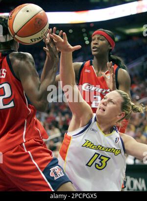 Houston Comets players Michelle Snow, left, and Sheryl Swoopes congratulate  each other after the Comets beat the Minnesota Lynx 77-73 in overtime in  Minneapolis, Friday Aug. 4, 2006. Swoopes led Houston with