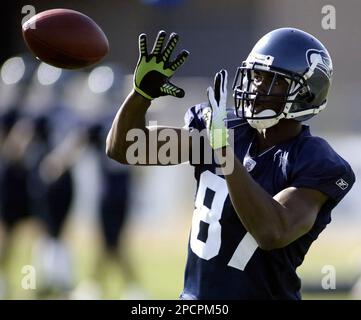 Seattle Seahawks' Ben Obomanu catches a ball as he warms-up before an NFL  football game against the Dallas Cowboys, Sunday, Sept. 16, 2012, in  Seattle. (AP Photo/Kevin P. Casey Stock Photo 