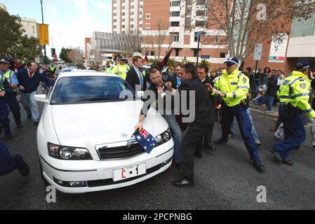 Pro-Lebanon protesters mobbed Australia's prime minister car in violent clashes with police in the western city of Perth, Australia, Saturday, July 29, 2006. The protesters were condemning the prime minister's support for Israel and demanding action to bring peace in the Middle East. (AP Photo/News LTD) **AUSTRALIA OUT**