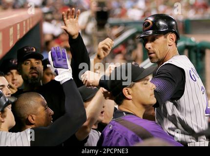 Arizona Diamondbacks' Luis Gonzalez, right, embraces teammate Craig Counsell  after Counsell hit a solo home run against the San Diego Padres during the  fourth inning of a baseball game Sunday, Oct. 1