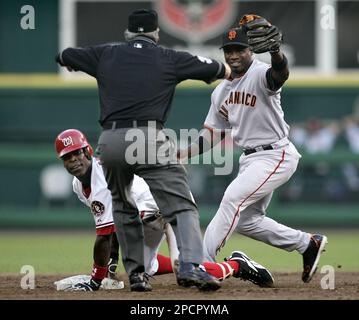 Washington Nationals (12) Alfonso Soriano makes the safe sign after being  thrown out at home plate in the 8th inning at Shea Stadium in New York City  on April 4, 2006. The