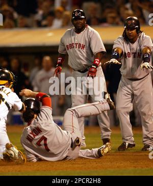 Boston Red Sox catcher Jason Varitek watches his home run hit go