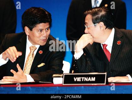 Thailand Foreign Minister Kantathi Suphamongkhon, right, chats 