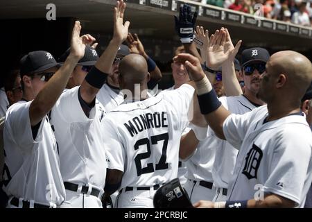 Detroit Tigers Craig Monroe is congratulated by teammate Curtis