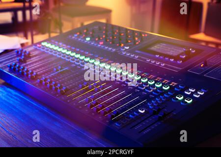 Professional mixing console on table in radio studio, closeup Stock Photo