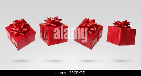 Beautifully wrapped gift boxes flying on light background Stock Photo