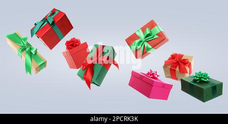 Beautifully wrapped gift boxes flying on light background Stock Photo