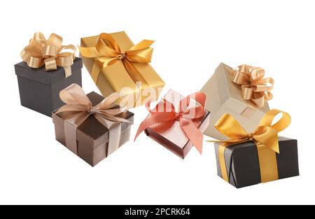 Beautifully wrapped gift boxes flying on white background Stock Photo