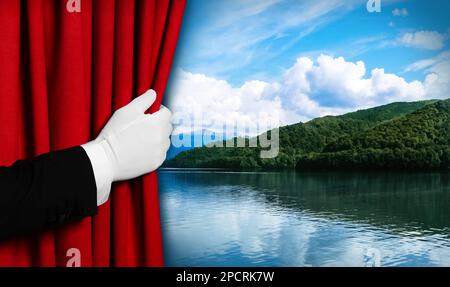 Man opening red front curtain and picturesque view of river and mountains on background Stock Photo