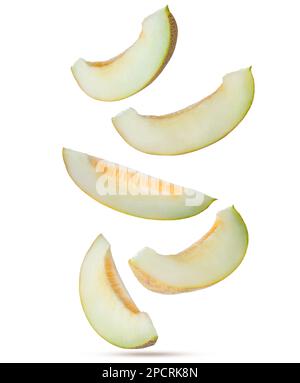 Pieces of delicious ripe melon falling on white background Stock Photo