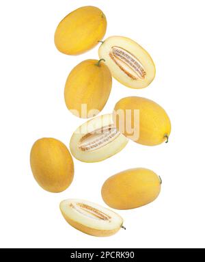 Delicious ripe melons falling on white background Stock Photo