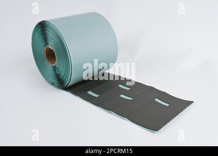 Roll of gray foam rubber sheet isolated in white. High quality photo Stock Photo