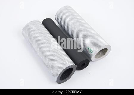 Roll of gray foam rubber sheet isolated in white. High quality photo Stock Photo