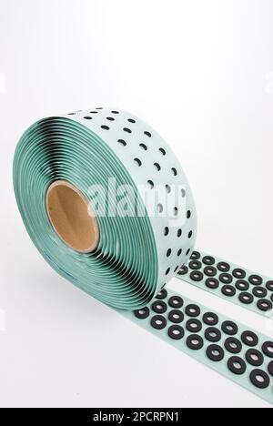 Roll of gray foam rubber sheet isolated in white. High quality photo Stock Photo