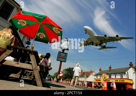 An Airbus A380-800 flies over The Swan pub as it comes in to land after taking part in a flying display at the Farnborough International Airshow in Farnborough, southern England, Monday July 17, 2006. The biennial show, which is in its 45th year, showcases aerospace equipment and technology and is the largest aerospace event in the world. (AP Photo/Matt Dunham)