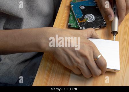 top view, man assembling an external hard drive Stock Photo