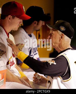 Chuck Tanner, manager of the 1979 world champion Pittsburgh Pirates, draws  a laugh from players of that team, Dave Parker, right, Steve Nicosia,  center, and Omar Moreno, left, as he plays with