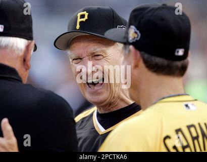 Chuck Tanner, manager of the 1979 world champion Pittsburgh Pirates, draws  a laugh from players of that team, Dave Parker, right, Steve Nicosia,  center, and Omar Moreno, left, as he plays with