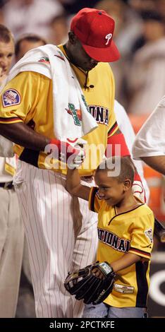 Philadelphia Phillies Ryan Howard is congratulated by son Darian Alexander,  5, after he won the baseball All Star Game home run derby in Pittsburgh,  Monday, July 10, 2006.(AP Photo/Gene J. Puskar Stock
