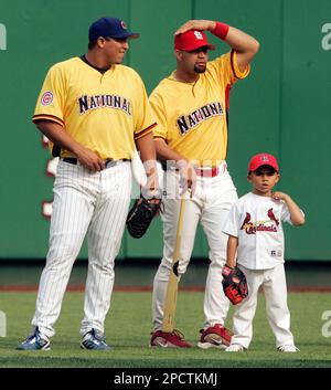 From left to right, Los Angeles Angels owner Arte Moreno, son of Albert  Pujols, Alberto Pujols Jr., owner Carole Moreno, wife of Albert Pujols,  Deidre Pujols, Albert Pujols, C.J. Wilson, general manager