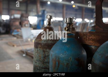 Part of the oxygen cylinders in the welding shop of the plant. Stock Photo