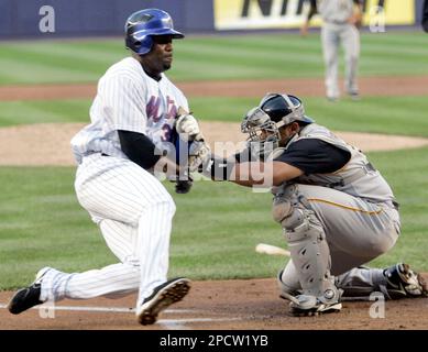 New York Mets Cliff Floyd is safe at home on a late tag by Atlanta Braves  catcher Brian McCann to score in the sixth inning July 29, 2006, in  Atlanta's Turner Field.